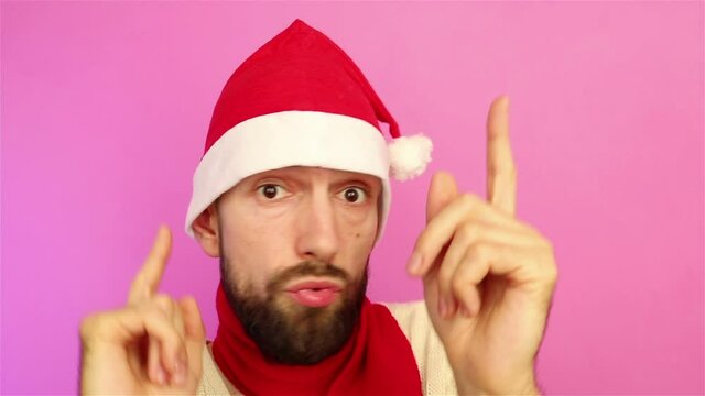 bearded man blogger in santa hat  having fun dancing christmas party close up