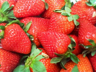 Closeup shot of fruit background of organic red fresh sweet strawberries