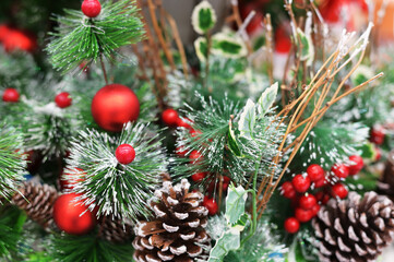 Close-up Photo of New Year's red balls on a Christmas tree on a blurred background