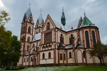 Fototapeta na wymiar Freiburg im Breisgau/Germany - 10 28 2012: Herz-Jesu-Kirche in Freiburg in a cloudy autumn day after first snow