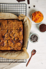 Top view of a freshly baked delicious pumpkin swirl brownies in a baking tray