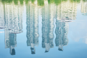 Blurred shadow of the tall building in the water