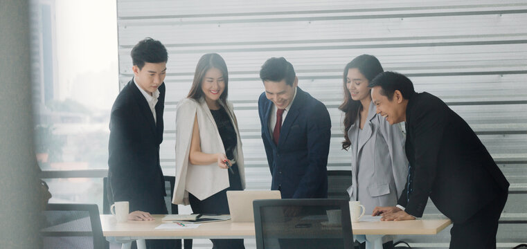 asian business team brainstorm idea at office meeting, Image of four successful business partners working at meeting in office