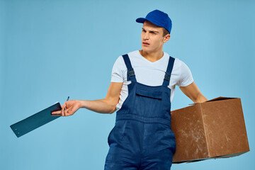 Man worker with cardboard box delivery loader lifestyle blue background