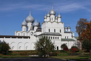 Beautiful white Christian Church on the background of blue sky and sun, historical landscape, architectural ensemble