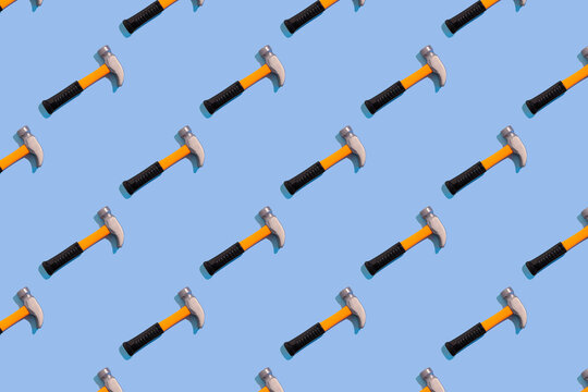 Toy Hammer Regular Pattern Blue Background Construction Minimal Concept Trendy sunlight.