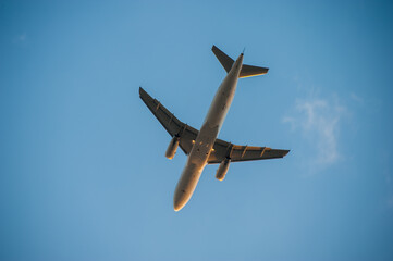 Passenger airplane flying above clouds. Travel concept, air travel
