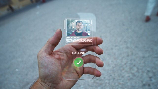 New infographics interface. Closeup of man hand using futuristic smartphone mobile for online communication. Internet video call. Business people. Networking application. Connecting worldwide.