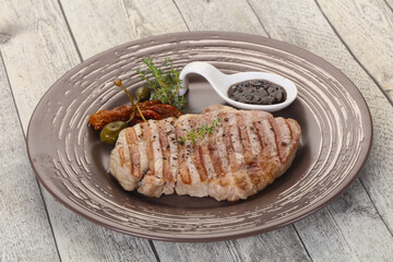 Grilled pork steak with pepper sauce