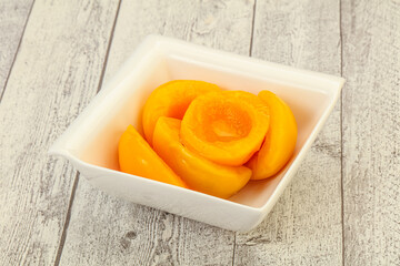 Marinated peaches fruit in the bowl