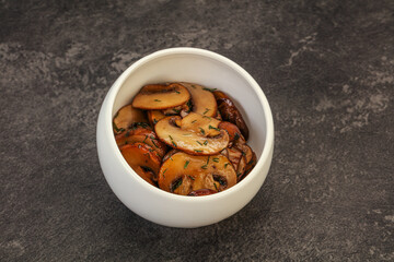 Roasted champignon with herbs and spices