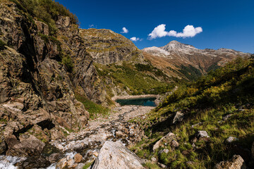 Clear mountain lake with blue-green water.