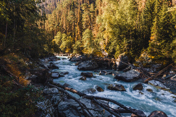Canyon of mountain river with blue water. Autumn in Caucasus mountain. Hiking and eco tourism in mountain.