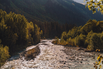 Canyon of mountain river with blue water. Autumn in Caucasus mountain. Hiking and eco tourism in mountain.