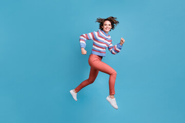 Full length body size side profile photo of jumping high hurrying up funky girl isolated on vibrant blue color background