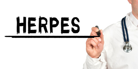 Doctor writes the word - HERPES. Image of a hand holding a marker isolated on a white background.