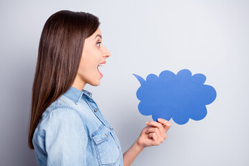 Profile side photo of pretty funky young lady hold cloud talk card speak secret isolated on grey color background