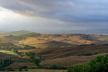 Fototapeta na wymiar Beautiful sunrise over the valley of San Quirico d Orcia, Toscana, Italy