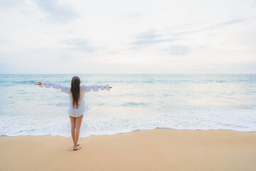 Fototapeta na wymiar Portrait beautiful young asian woman relax leisure around outdoor beach sea ocean