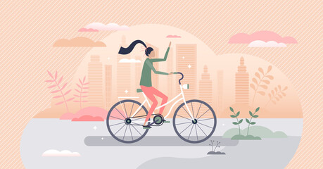Girl riding bike as urban cycling transportation scene tiny person concept © VectorMine