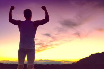 Fototapeta na wymiar Success fit athlete man with arms up winning fitness goal challenge silhouette at dusk outdoor against mountain sunset. Life change, weight loss achievement winner person.