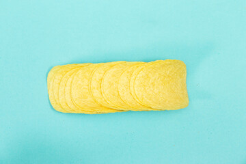 potato chips isolated on blue background