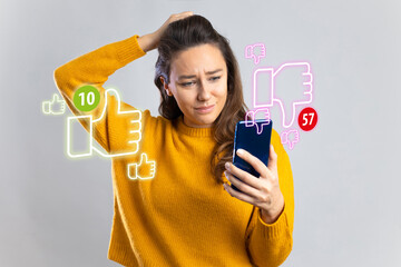 Young woman holding mobile phone looking too much dislikes on her social media post