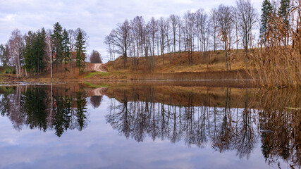 autumn view of a small lake, forest reflections, autumn