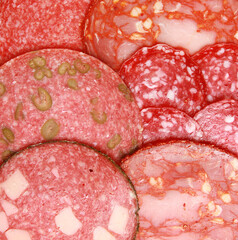 Closeup texture of thin salami slices