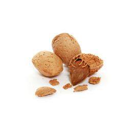 Closeup shot of almond nuts with cracked shell isolated on a white background