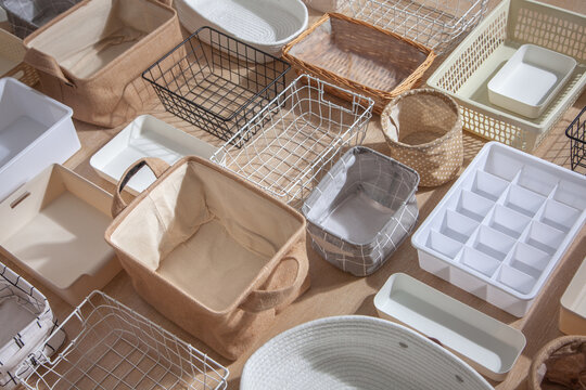 Flat lay of Marie Kondo's storage boxes, containers and baskets with different sizes and shapes