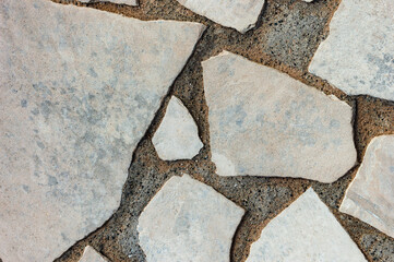Fototapeta premium Cracked Concrete Texture Cobblestone Closeup