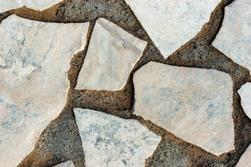 Fototapeta premium Cracked Concrete Texture Cobblestone Closeup