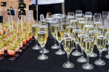 Glasses of champagne on the table with shallow depth of field