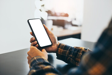 cell phone blank white screen mockup.woman hand holding texting using mobile on desk at office.background empty space for advertise.work people contact marketing business,technology