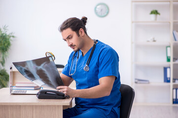 Young male doctor working in the clinic