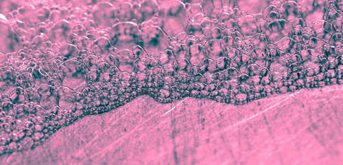 Pink foam in the sink as an  background.