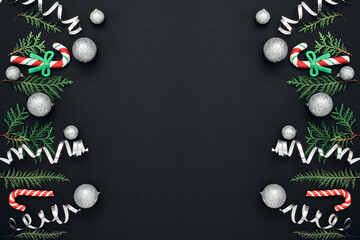 New Year's, festive decor on a black background. Copy space, flat lay, mock up, top view.