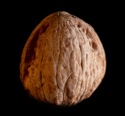 Walnut isolated on black background.