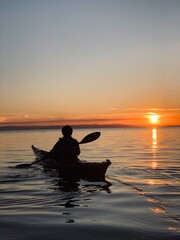 silhouette of a person in a boat