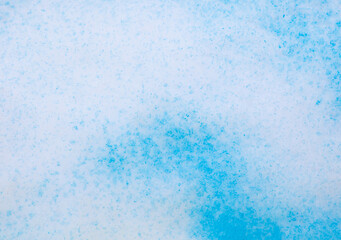 Blue paint on the snow in winter.
