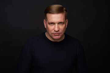 Fototapeta premium Studio portrait of a 40 years old caucasian man