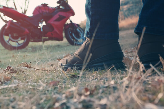 malada man eden on a red motorcycle