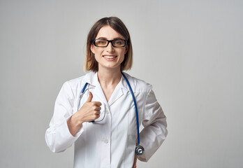 woman doctor with stethoscope gesturing with hands emotions glasses model