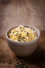 Pot of butter, coarse salt and chives