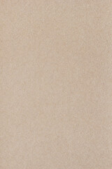 Fototapeta na wymiar Textured brown vintage paper background. Vertical background for design, closeup