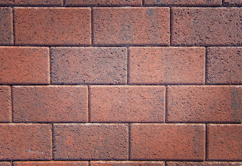 Good masonry of short rectangular blocks, red background