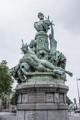 Fototapeta na wymiar The monument to Francis Garnier in Paris, France. Monument is an ensemble carved in 1898, dedicated to Francis Garnier, naval officer and French explorer.