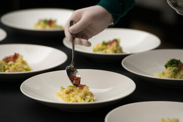 Irish colcannon served in a white bowl or traditional mashed potato with addition of kale, leek and green onion, close-up