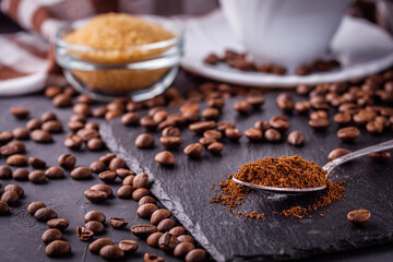cup of fragrant fresh coffee on a dark stone background
